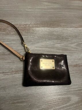 Michael Kors Dark Brown Embossed Logo Wristlet with Gold Plaque